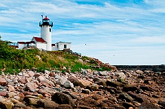 Low Tide Displays Rocky Shore By Eastern Point Lighthouse